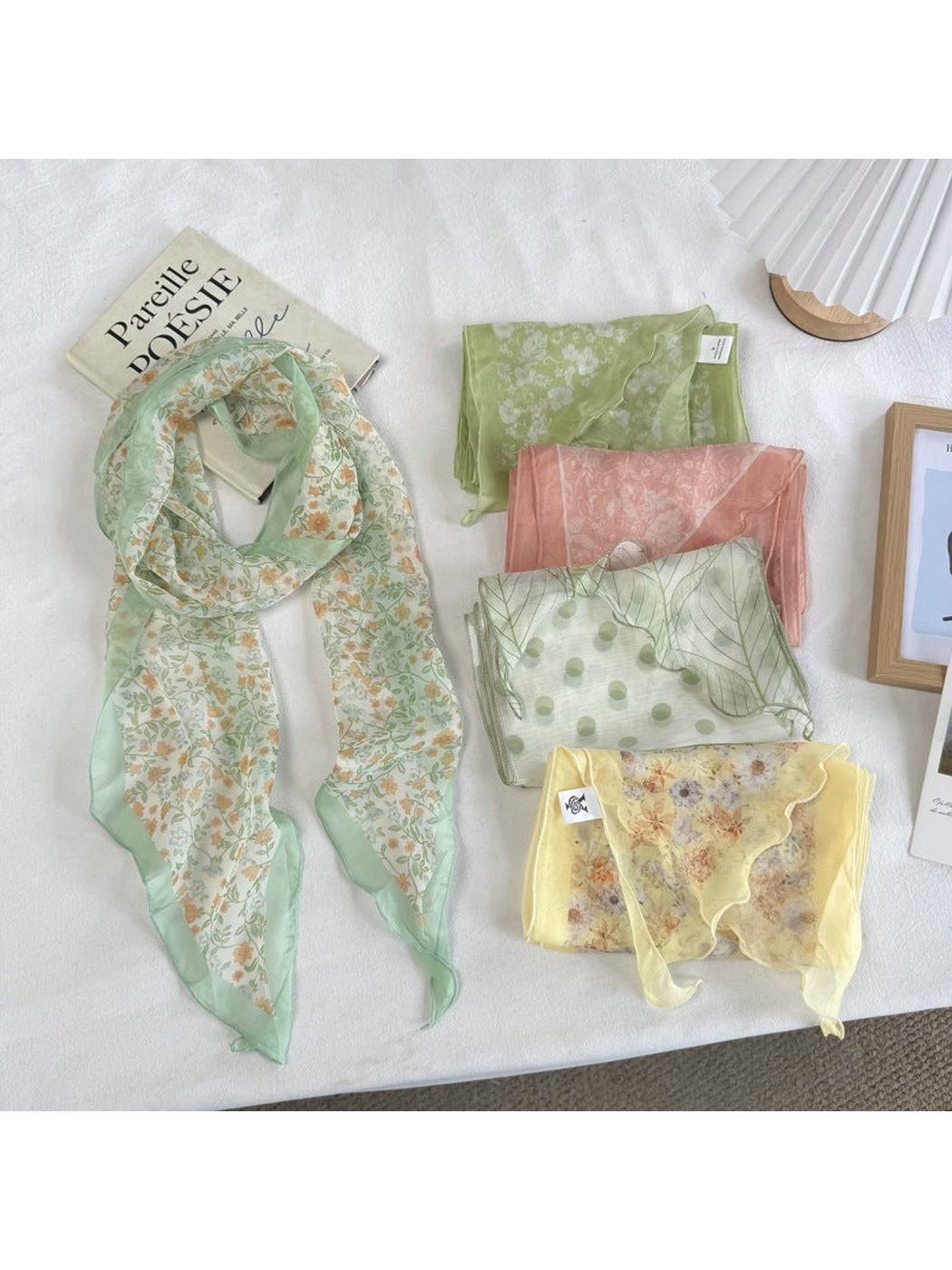 Five floral scarf styles displayed together with the Mint Floral style draped open