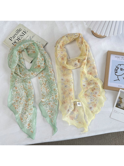 Mint Floral and Yellow Floral scarves displayed side by side