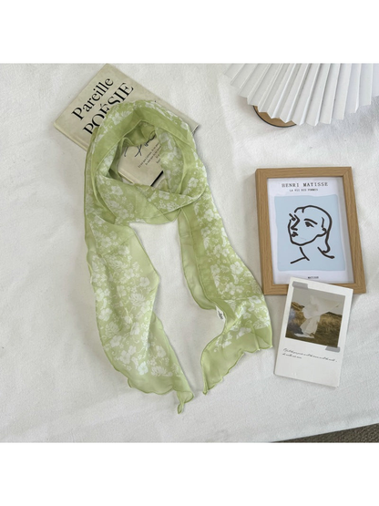 Green Floral scarf with a white floral silhouette pattern and wavy edge