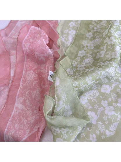 Close-up of the Pink Floral and Green Floral scarf patterns and wavy edges