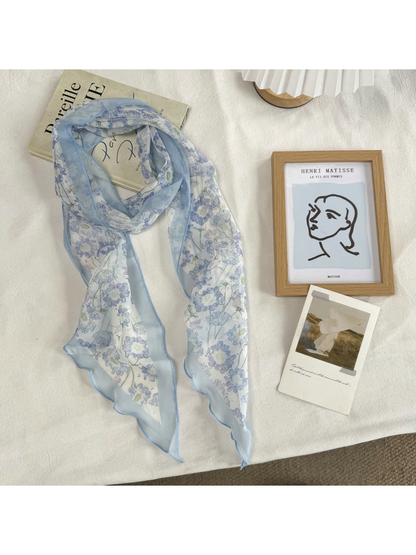 Blue Floral scarf with blue blossoms and waved edges, full view