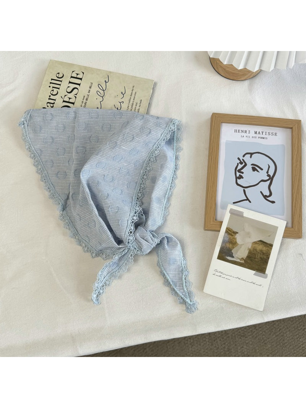 Blue triangle scarf with ring motifs, scalloped lace trim and tied ends