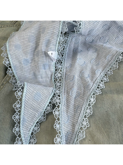 Close-up of the Blue scarf pattern and floral scalloped lace trim