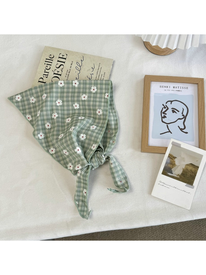 Green plaid narrow scarf with white daisy motifs and tapered tie ends