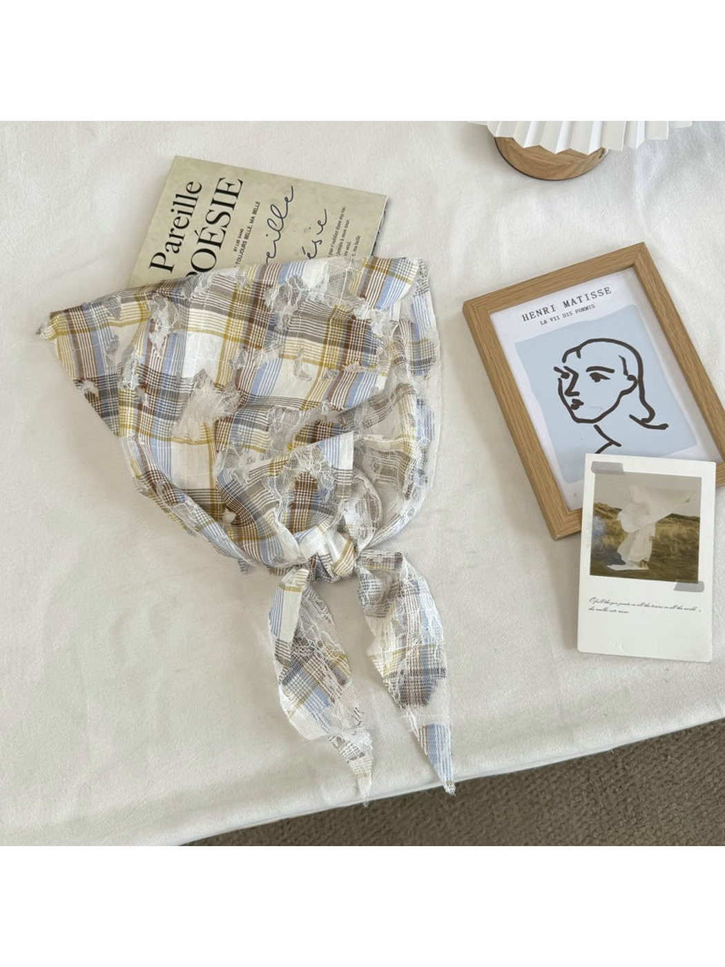 Blue plaid lace scarf with frayed cutout accents, tied view