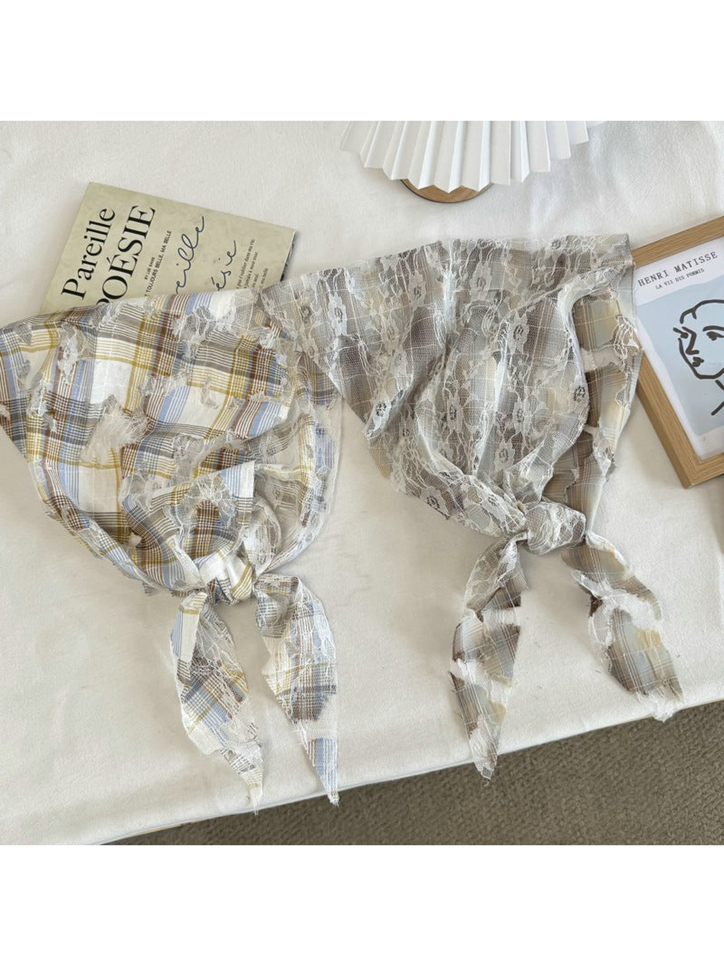 Blue and Beige plaid lace scarves arranged with tied ends