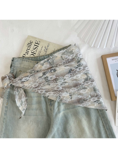 Beige plaid lace scarf styled over light-wash jeans