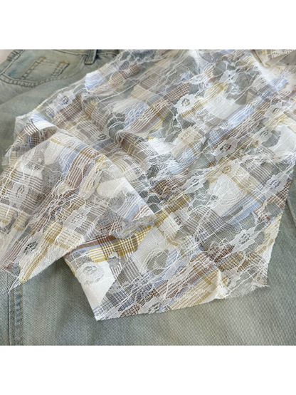 Close-up of Blue plaid, floral lace and frayed cutout details