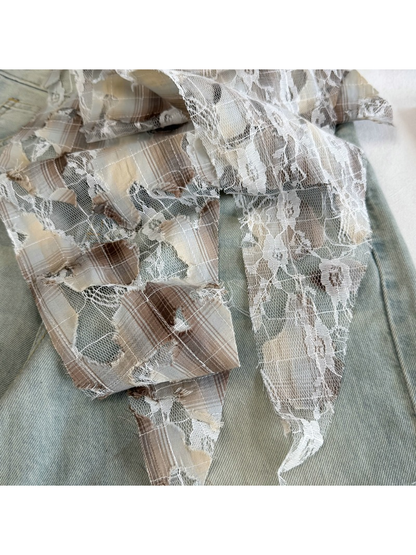 Close-up of Beige plaid tie ends with floral lace and frayed cutouts