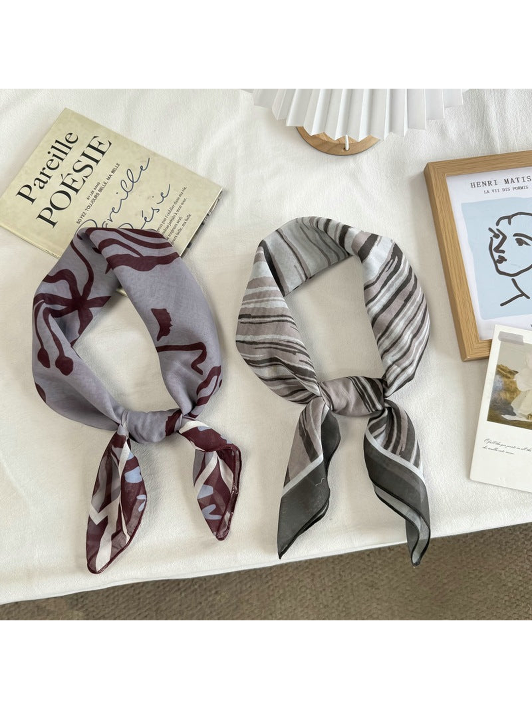 Gray Faces and Black Stripes square scarves styled with knotted ends
