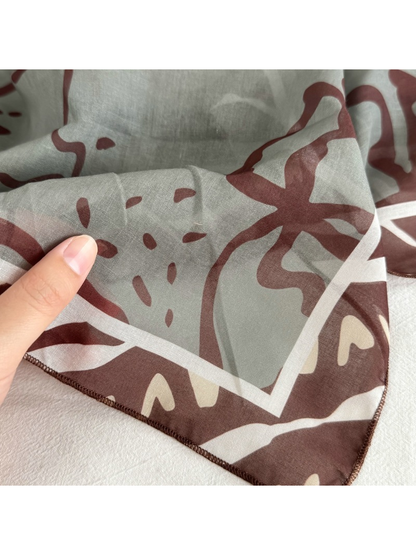 Close-up of the narrow stitched edge and semi-sheer patterned surface