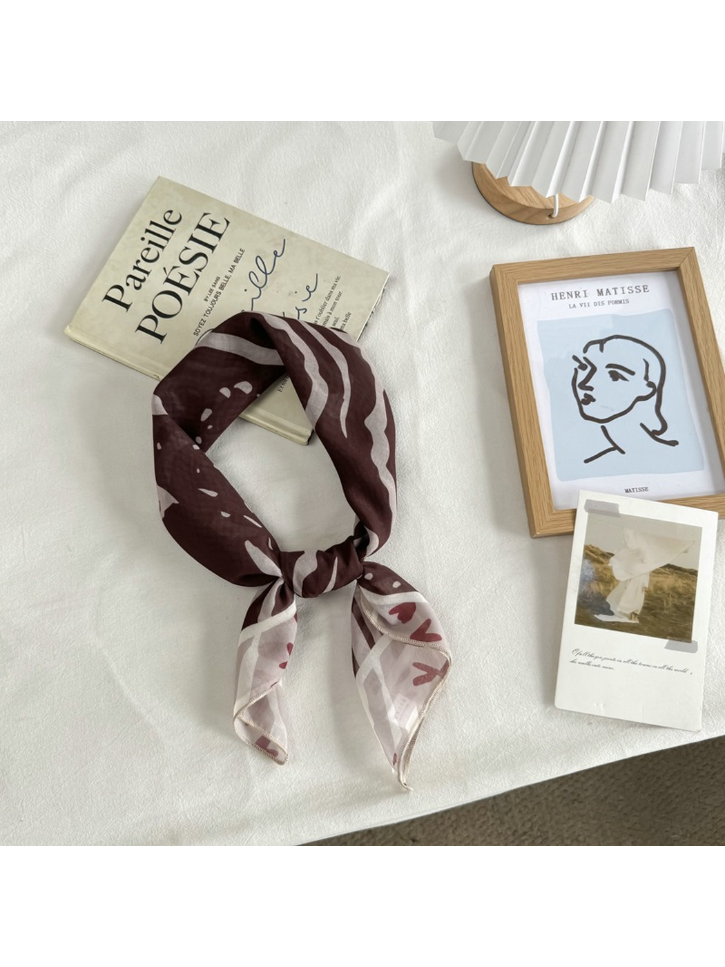 Coffee Faces square scarf arranged in a loose neck-style knot