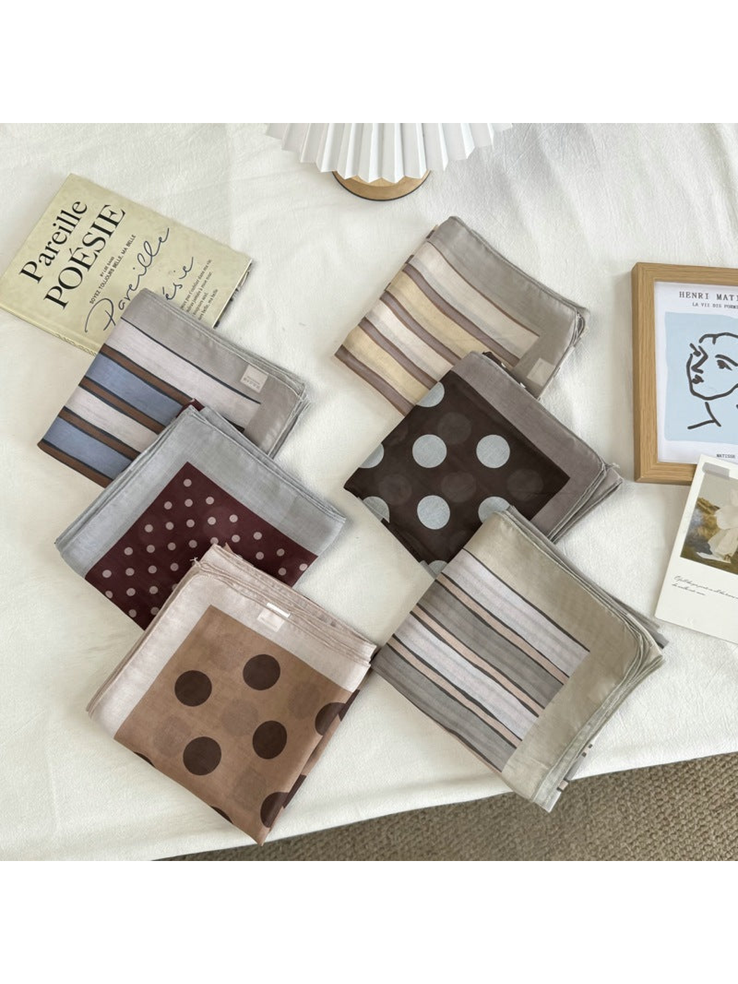 Six folded square scarf styles in striped and mixed-scale polka dot patterns