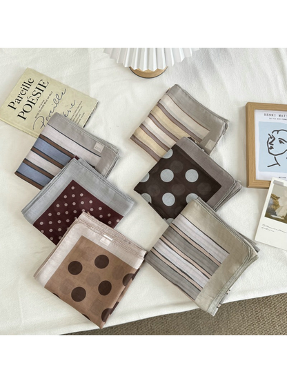 Six folded square scarf styles in striped and mixed-scale polka dot patterns