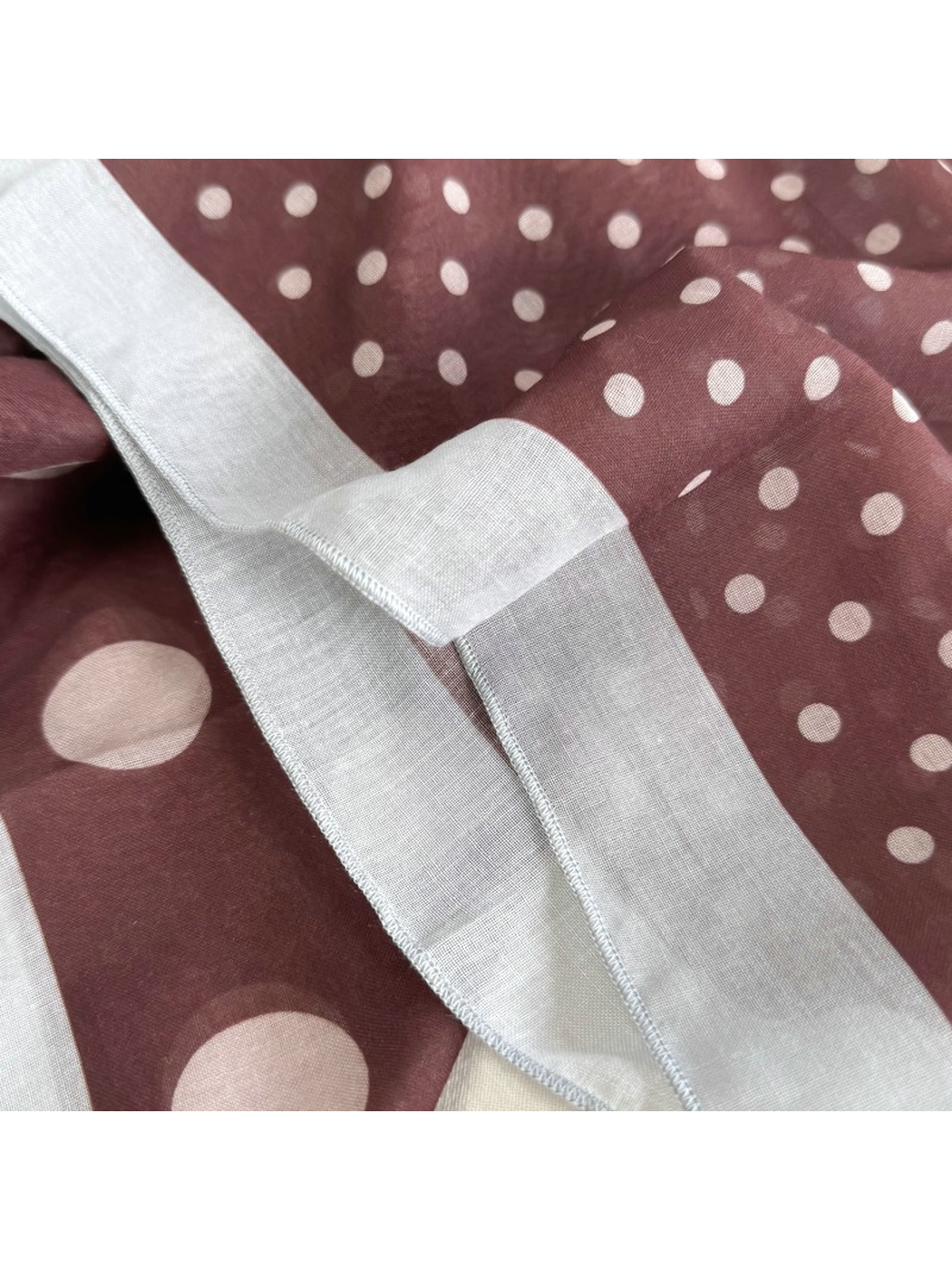 Close-up of the Burgundy Dots scarf border and narrow stitched edge