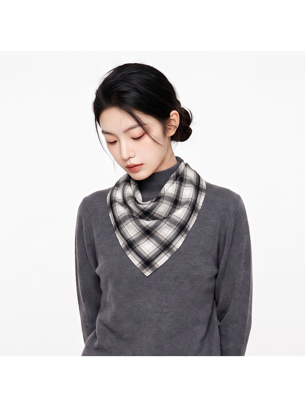 Black Gray plaid square scarf draped around the neck over a gray turtleneck