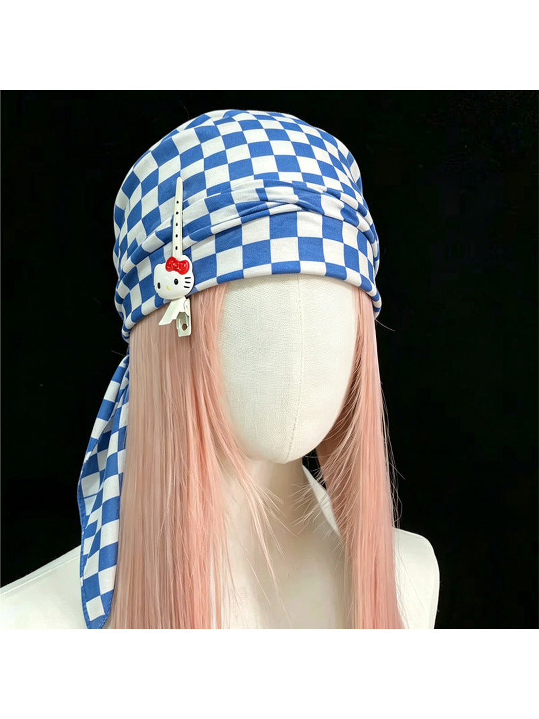 Checkerboard scarf styled as a head wrap on a mannequin