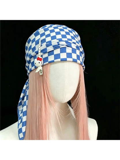 Checkerboard scarf styled as a head wrap on a mannequin