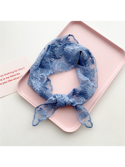 Light Blue sheer floral triangle scarf tied in a loop