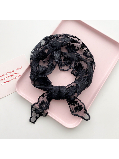 Black sheer floral triangle scarf tied in a loop