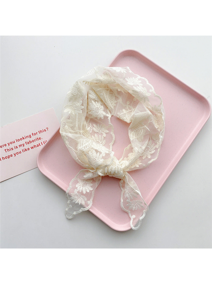 Ivory sheer floral triangle scarf tied in a loop