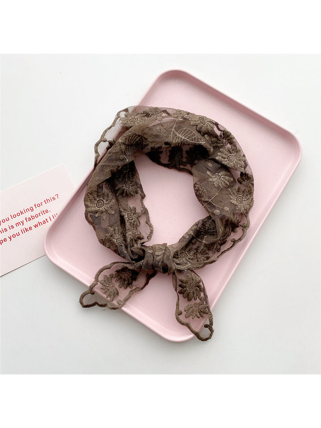 Brown sheer floral triangle scarf tied in a loop