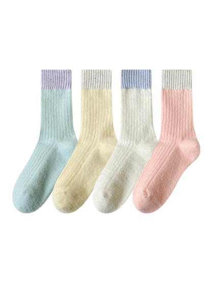 Ivory, yellow, light blue, and light pink ribbed crew socks displayed together