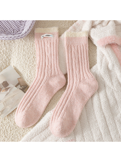 Light Pink ribbed crew socks with contrasting fuzzy cuffs, flat lay