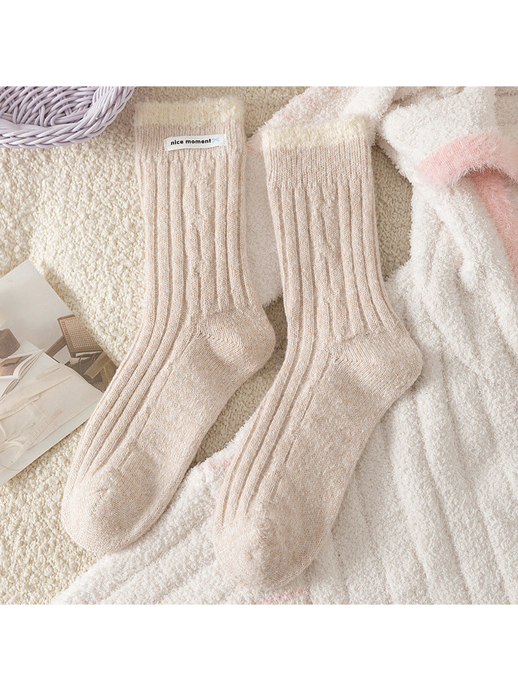 Beige ribbed crew socks with contrasting fuzzy cuffs, flat lay