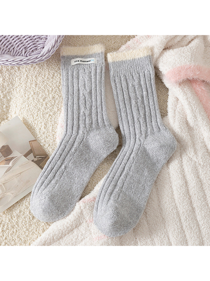 Light Gray ribbed crew socks with contrasting fuzzy cuffs, flat lay