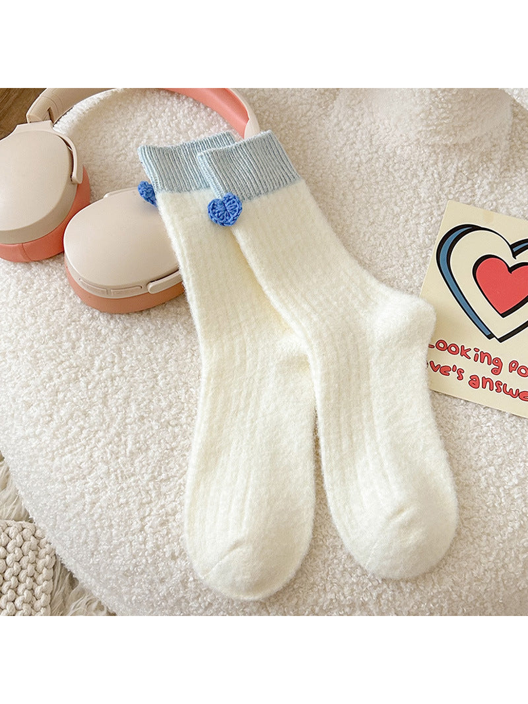 Ivory crew socks with light blue ribbed cuffs and heart accents