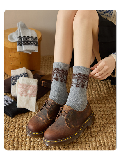Heather Gray geometric-border socks worn with brown lace-up shoes