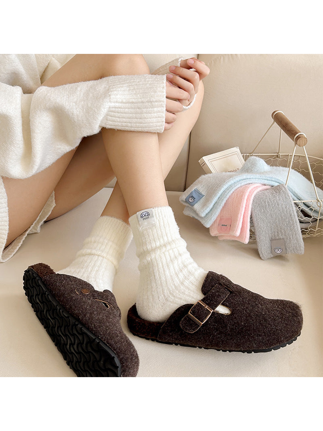 Ivory ribbed crew socks worn with brown clogs and additional colors displayed nearby