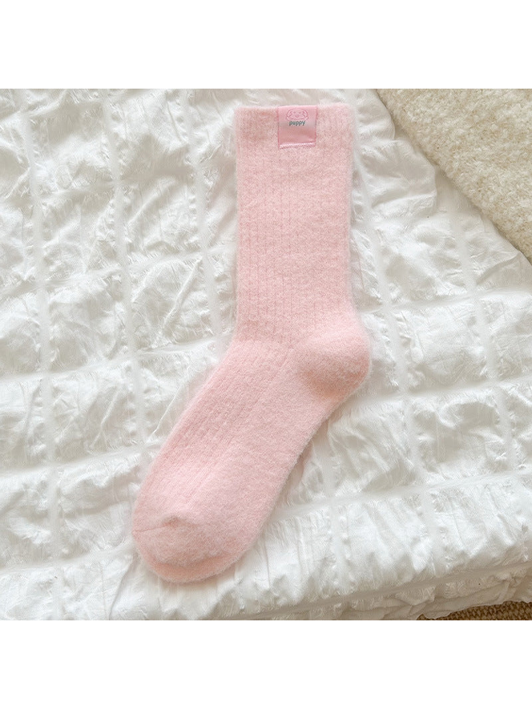 Light Pink ribbed crew sock with a small dog label