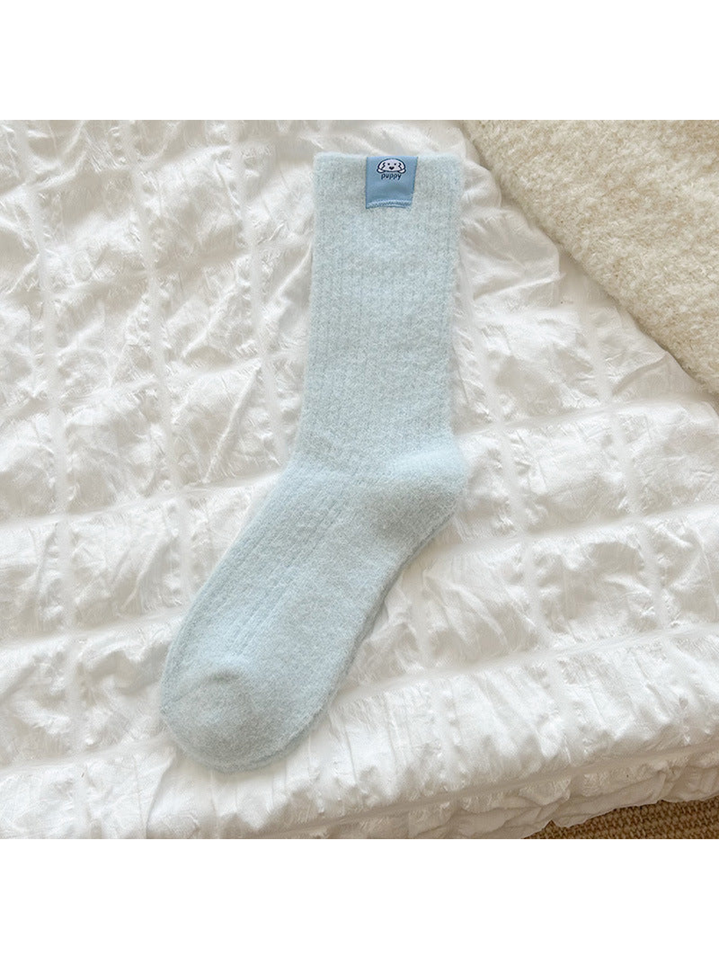 Light Blue ribbed crew sock with a small dog label