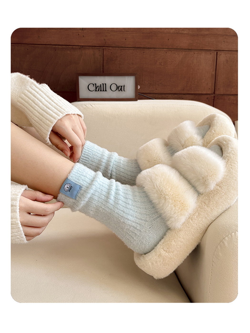 Close view of Light Blue ribbed crew socks worn with plush slippers