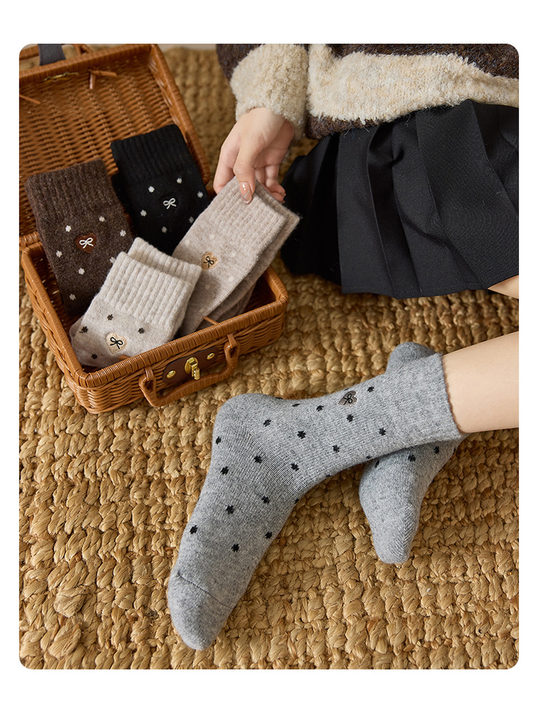 Heather Gray dot-pattern crew socks worn beside coordinating colors in a wicker case
