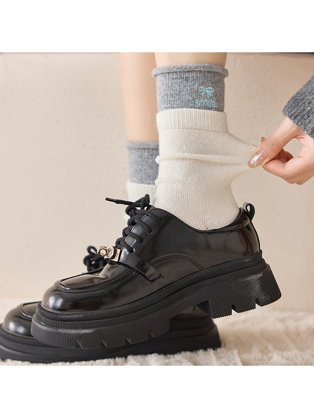 Close-up of an Ivory crew sock being pulled at the ankle