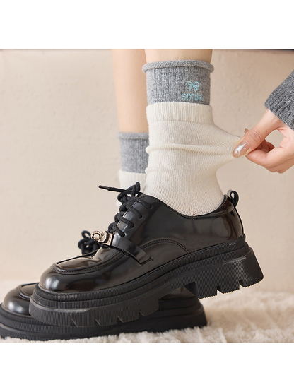 Close-up of an Ivory crew sock being pulled at the ankle