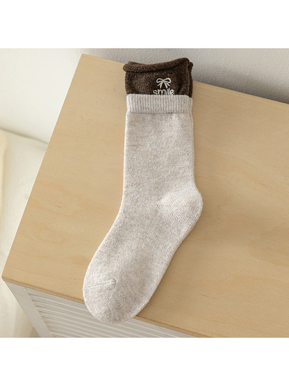 Beige crew sock with brown contrast cuff and embroidered bow
