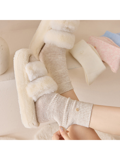 Close-up of Beige crew socks with ribbed cuffs and fine knit texture