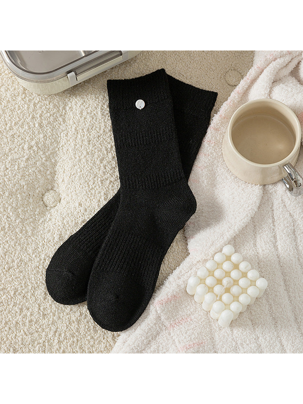 Black crew socks with ribbed bands and round cuff accent