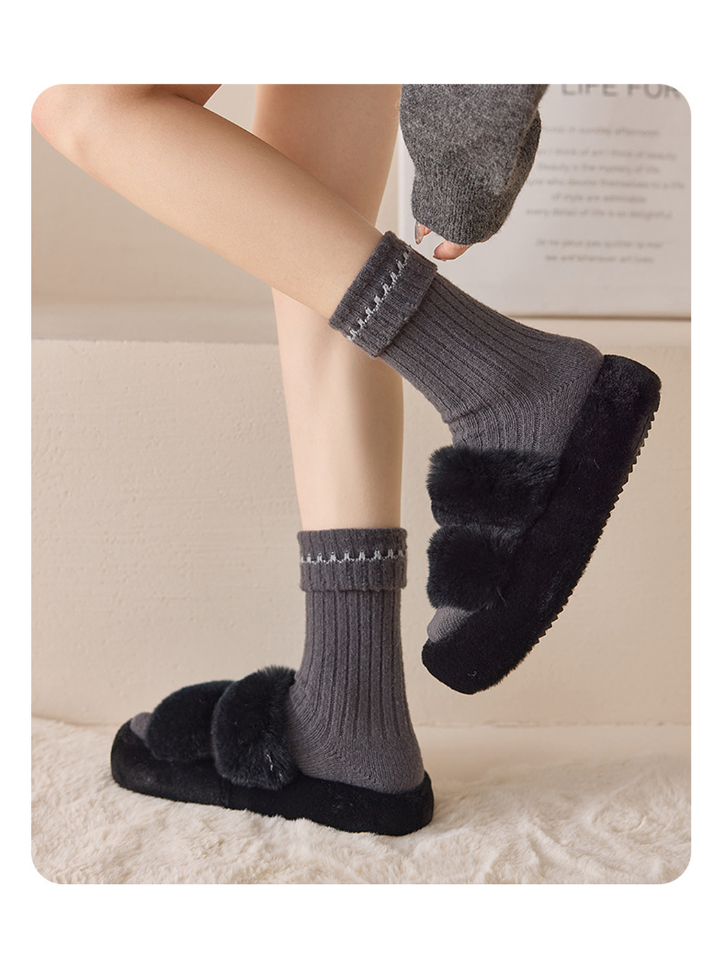 Gray White ribbed socks worn with black slippers in a side view