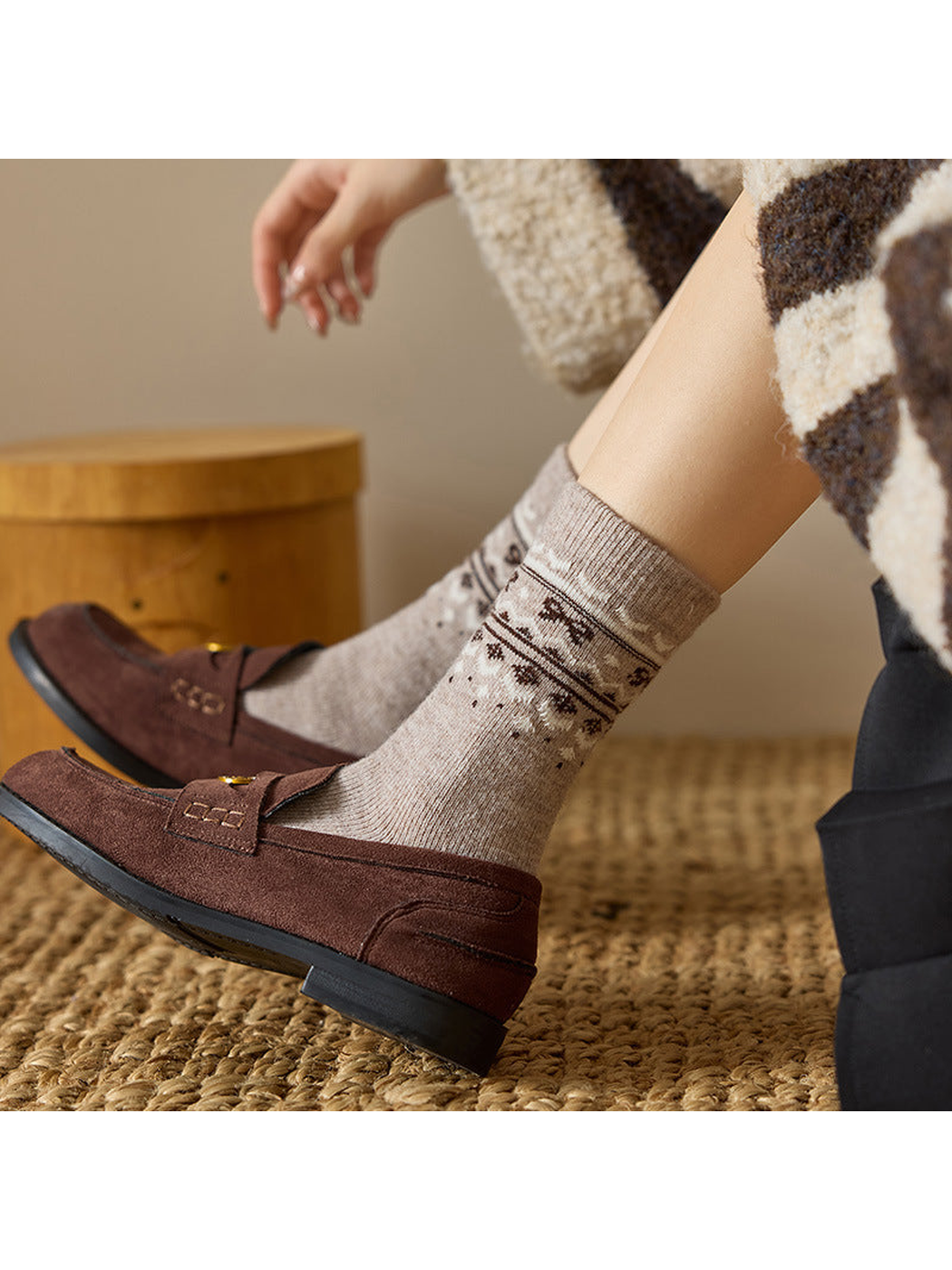 Greige patterned crew socks styled with brown loafers