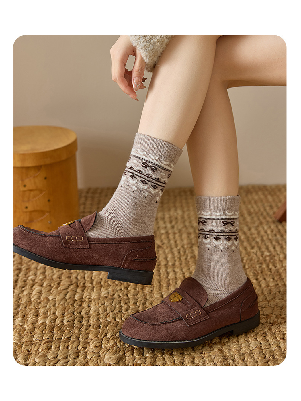 Greige patterned crew socks styled with brown loafers, standing view