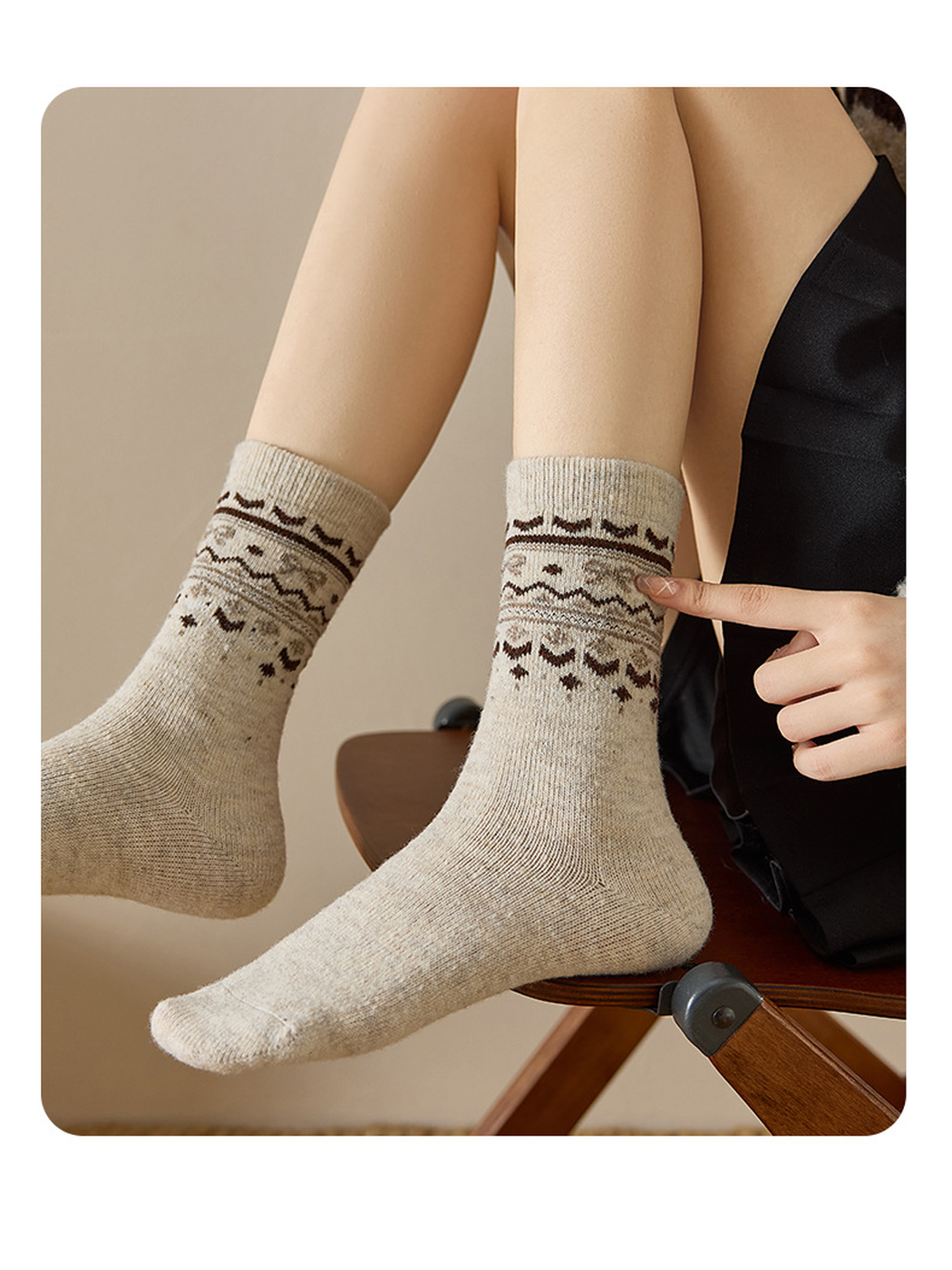 Close-up of neutral crew socks with contrasting geometric cuff bands