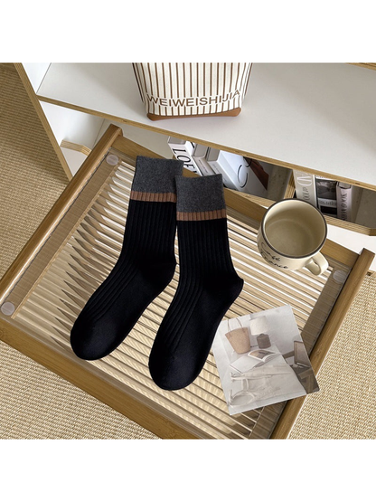 Black ribbed crew socks with a contrasting cuff stripe