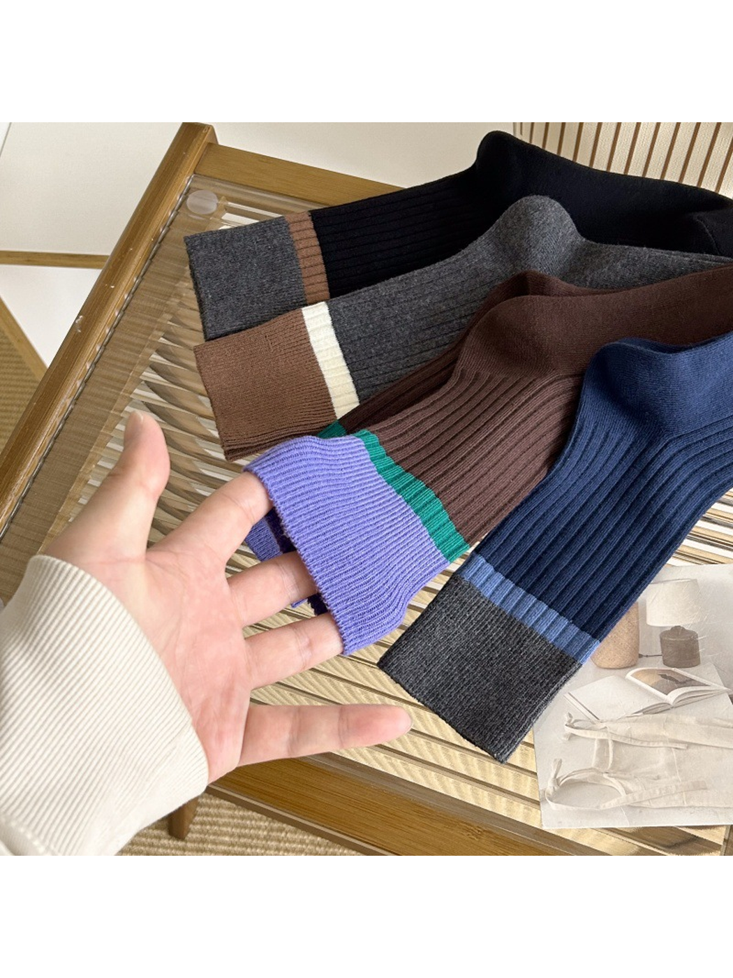 Close-up of the ribbed cuffs and contrasting stripes across four sock colors