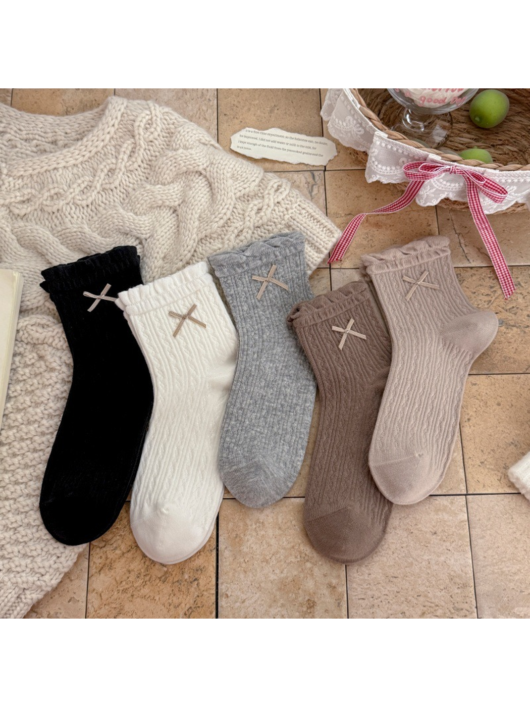 Black, White, Heather Gray, Greige, and Brown ankle socks displayed together