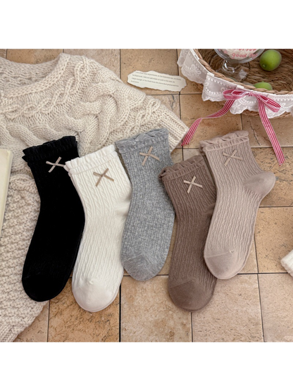 Black, White, Heather Gray, Greige, and Brown ankle socks displayed together